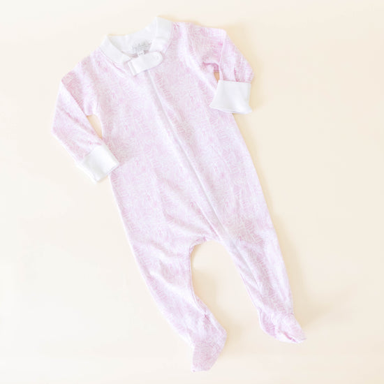 Pink Chicago print onesie on a neutral background