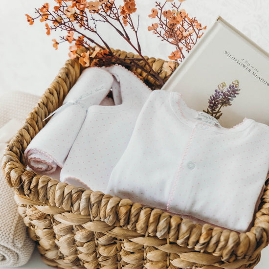 Polka dot 3-piece set for baby in a wicker basket